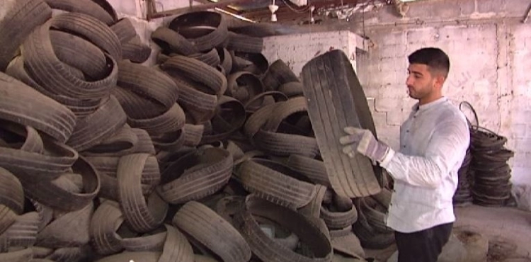 A young man from Gaza recycles damaged vehicle tires into friendly tools