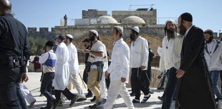 Settlers perform Talmudic rituals near one of the gates of Al-Aqsa