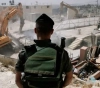 The occupation demolishes a commercial store in Jabal Mukaber