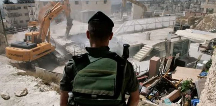 The occupation demolishes a commercial store in Jabal Mukaber