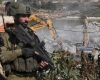 The occupation demolishes a house and a barn north of Jericho