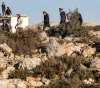 Settlers destroy a house under construction in Jericho