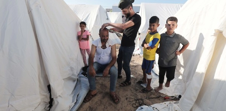 In pictures: UNRWA sets up a camp to shelter displaced people in the south of the Gaza Strip