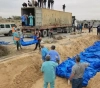 The occupation released them from Al-Shifa Complex. They buried the bodies of about 100 martyrs in Khan Yunis.