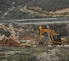 The occupation bulldozes 100 dunums and uproots about 150 olive trees east of Qalqilya