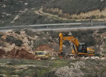 The occupation bulldozes 100 dunums and uproots about 150 olive trees east of Qalqilya
