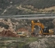 The occupation bulldozes 100 dunums and uproots about 150 olive trees east of Qalqilya