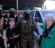 Al-Qassam hands over 13 prisoners and 4 foreigners to the Red Cross