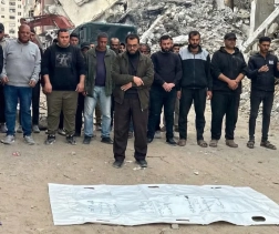 After two years under the rubble, a Palestinian man bids farewell to his wife and quadruplets in a single body bag in Gaza.