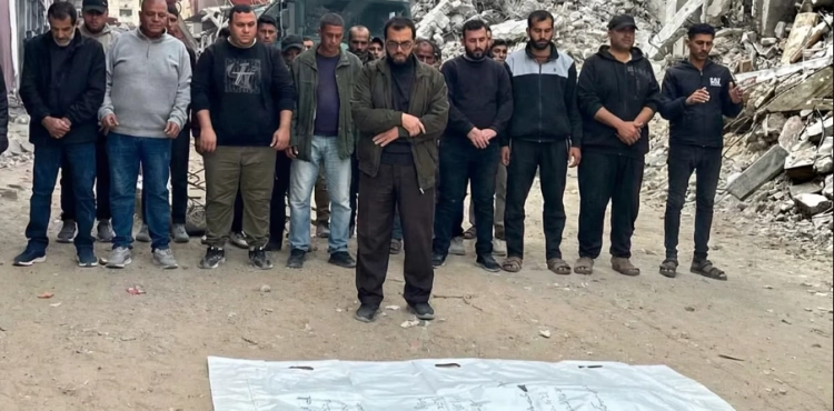 After two years under the rubble, a Palestinian man bids farewell to his wife and quadruplets in a single body bag in Gaza.