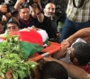 The crowds of Gaza are a martyr the child Ahmed the father of rope