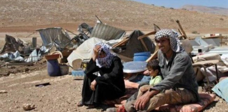 The occupation destroys a tent and assaults a youth by hitting a traveler to Yatta