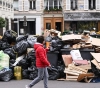 Heaps of rubbish obscure the sights of Paris, and its scent spreads through the city of lights