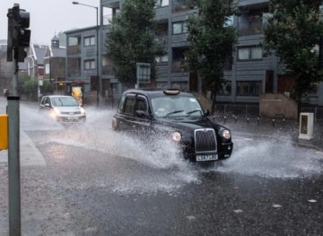 Water floods streets and underground stations in London due to thunderstorms