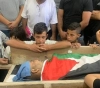 Large crowds, the funeral of the body of a martyr, Raed Jadallah, for a living