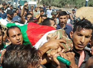 Thousands mourn Palestinian martyrs in Gaza