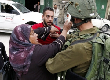 Israeli forces arrest a Palestinian woman from Ramallah