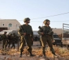 The occupation arrests 3 Palestinians from Ramallah and searches houses in Hebron