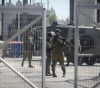 Occupation closes Qalandiya checkpoint, arrests two brothers in Hebron