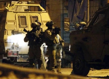 Israeli soldiers shot and killed a Palestinian intelligence officer and caused his leg to be amputated.