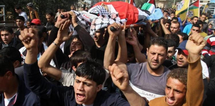 Gaza crowds spread the bodies of a child and a young man from the return procession