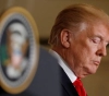 Trump says the US economy will collapse if he&acute;s isolated.