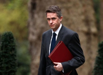 Dismissal of British defense minister over national security leaks