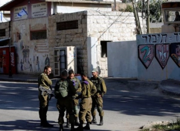 The arrest of a girl near the Cave of the Patriarchs