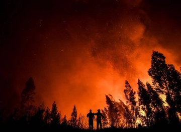 More than 1,000 firefighters are fighting fires in central Portugal