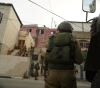 14 detainees at dawn on Wednesday, including brothers from Issawiya and Qalqilya