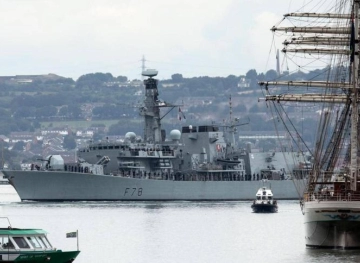 A British destroyer sails the Gulf to escort oil tankers