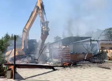 The Israeli occupation forces demolish a restaurant and a house in Beit Jala