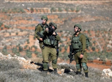 A young man from Kafr Qaddoum is arrested and a bulldozer and a truck are confiscated