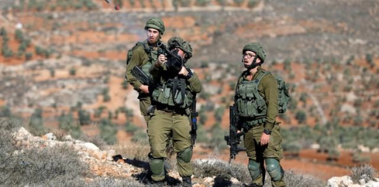A young man from Kafr Qaddoum is arrested and a bulldozer and a truck are confiscated