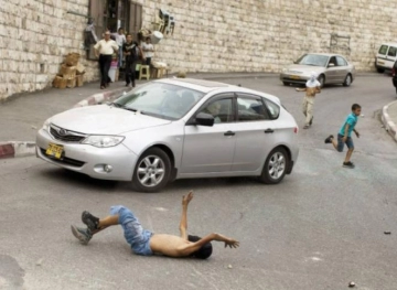 A settler runs over a child east of Bethlehem