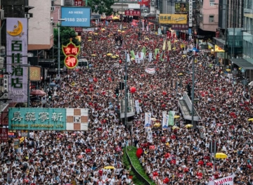 Thousands march in Hong Kong to protest police wounding student