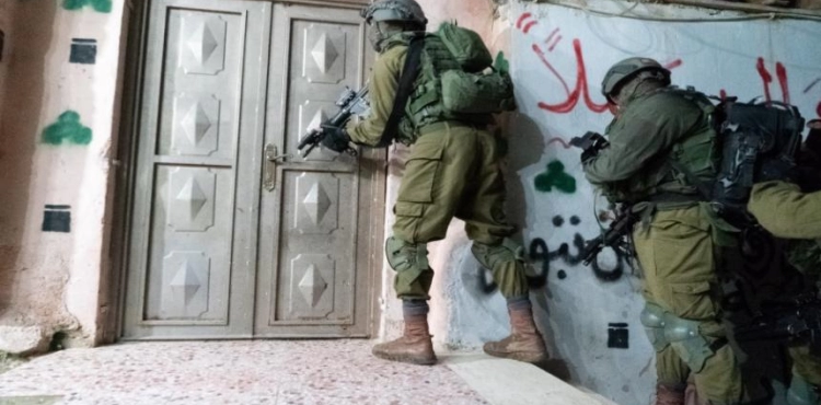 Israeli forces arrest citizens during separate raids in the West Bank