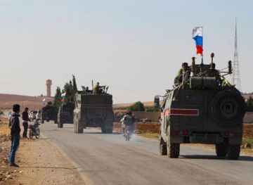 Russian troops patrol northern Syria near the Turkish border