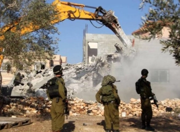 Israeli forces demolish a house in Jbara village south of Tulkarm