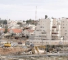Settlement engulfs land and isolates Palestinian communities and towns