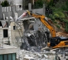 The occupation forces the Al-Debs family in Jabal Al-Mukaber to demolish their home
