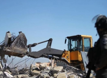 The occupation distributes construction and demolition warnings in Nahalin