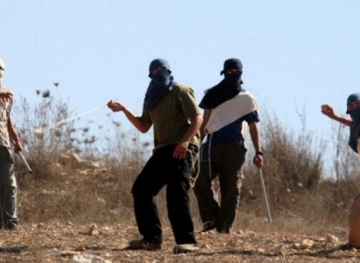Residents, as they confronted dozens of settlers, tried to storm their village
