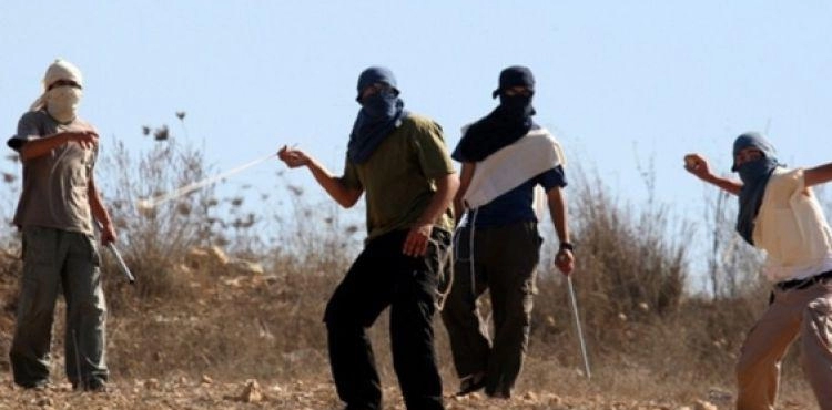 Residents, as they confronted dozens of settlers, tried to storm their village