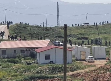 Settlers rebuild buildings in an outpost near Nablus
