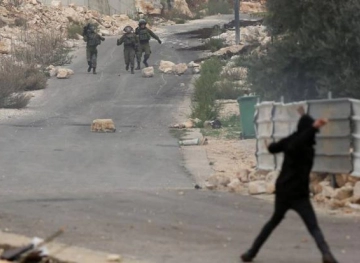Two youths were wounded by the Israeli occupation forces during clashes in Kafr Qaddum