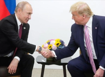 Trump and Putin hail the cooperation and &quot;trust&quot; between their two countries in remembrance of a meeting during WWII