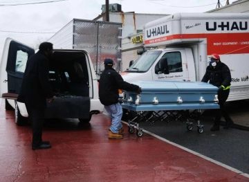 An investigation in New York after finding dozens of bodies inside trucks