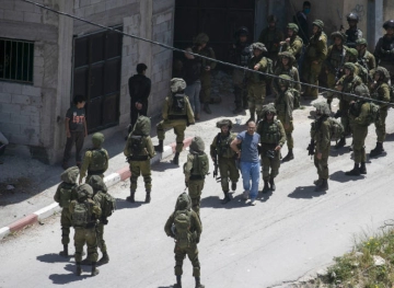Two youths were wounded by the Israeli occupation forces in Ya`bad, during a third storm in the town