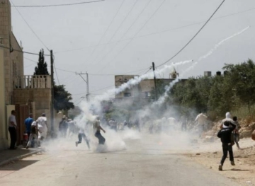 Dozens of cases of suffocation as a result of the occupation assault on the Kafr Qaddum march